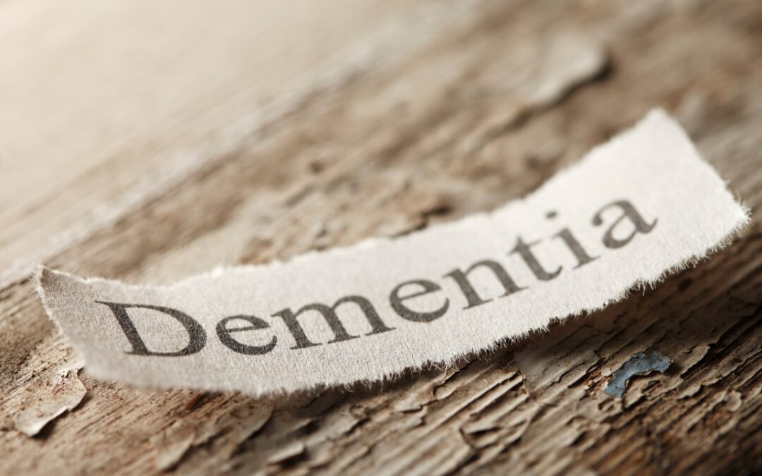 a piece of wood with a slip of paper on it that says "dementia"