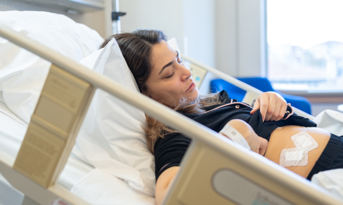 a woman in a hospital bed