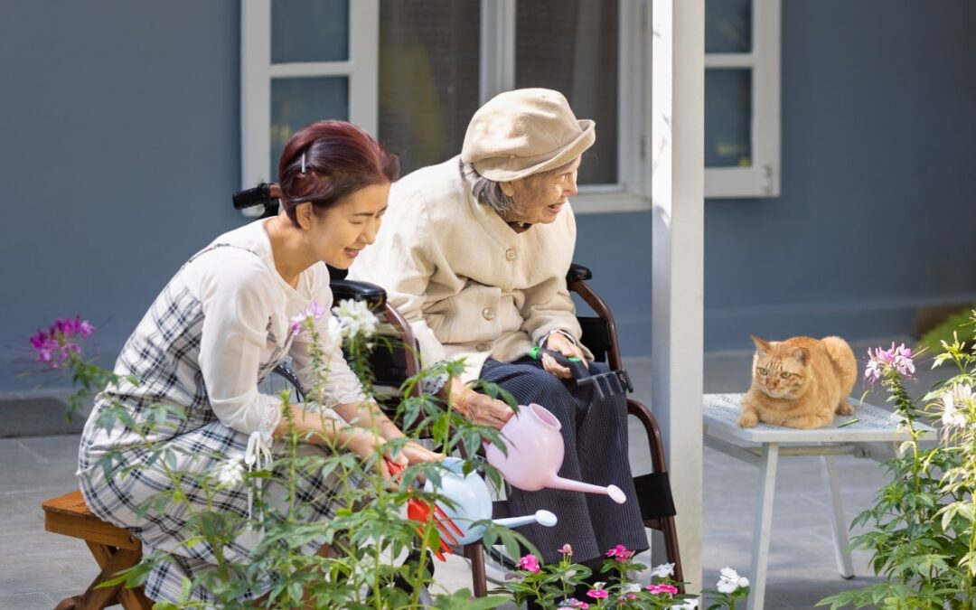 Elderly woman and daughter gardening