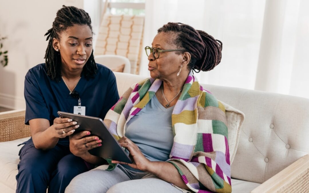 a young in home care specialist going over important information with a patient on short term support
